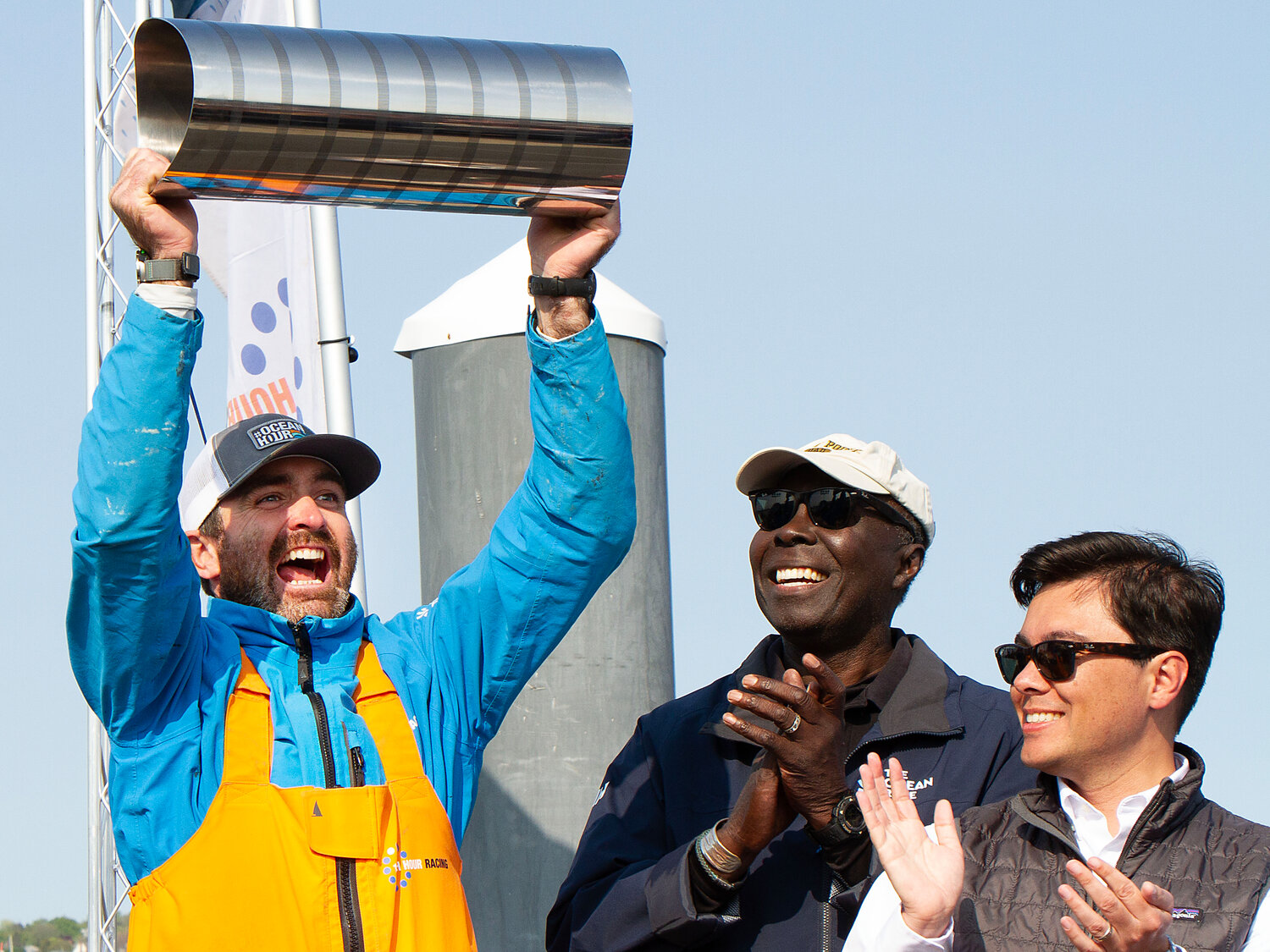 Skipper Charlie Enright of Barrington, hoists the cup after he and the 11th Hour Racing Team won Leg 4, during the Ocean Race 2023 in Newport.