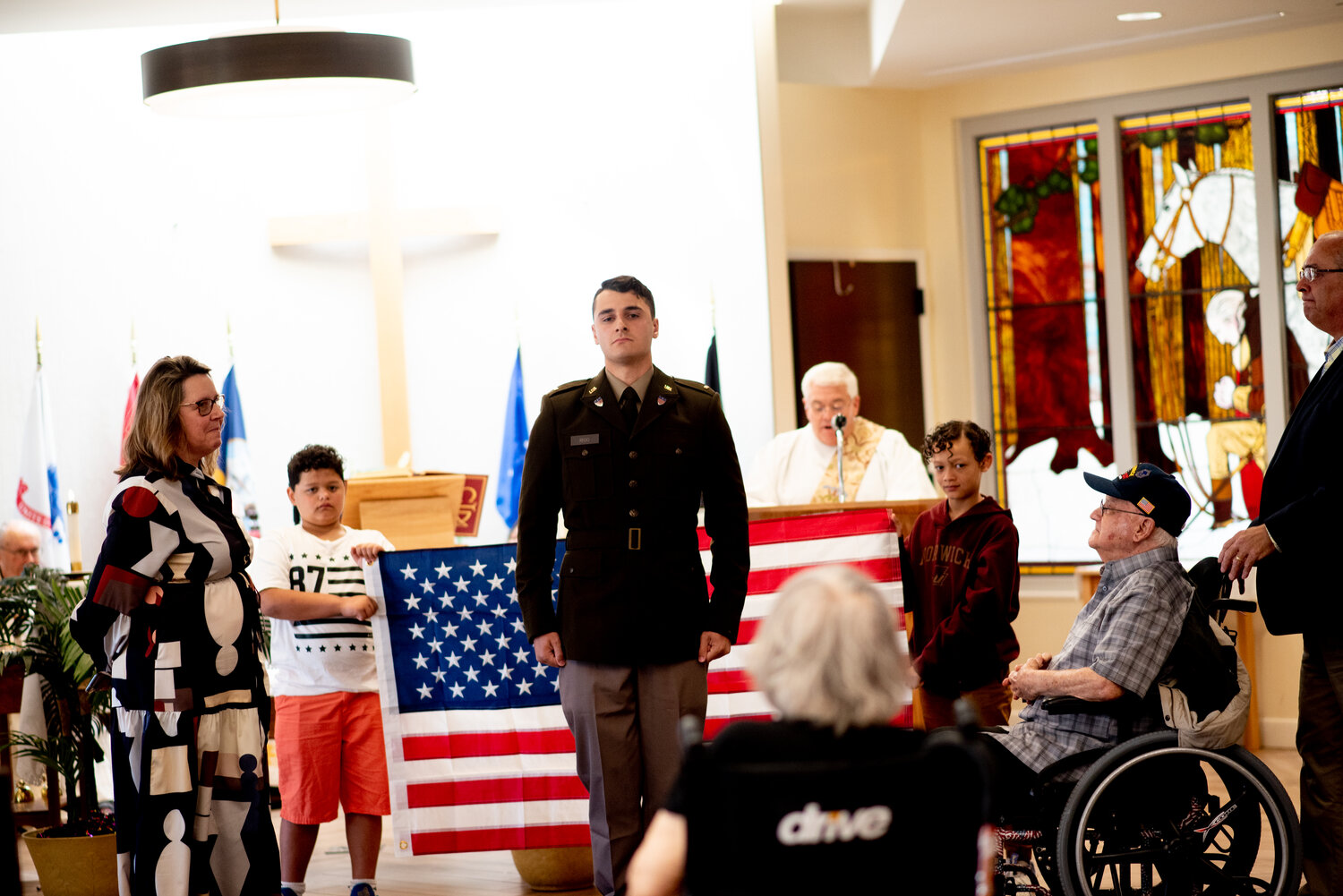 Chris Rego stands at attention during the ceremony on May 7 at the Rhode Island Veterans Home in Bristol.