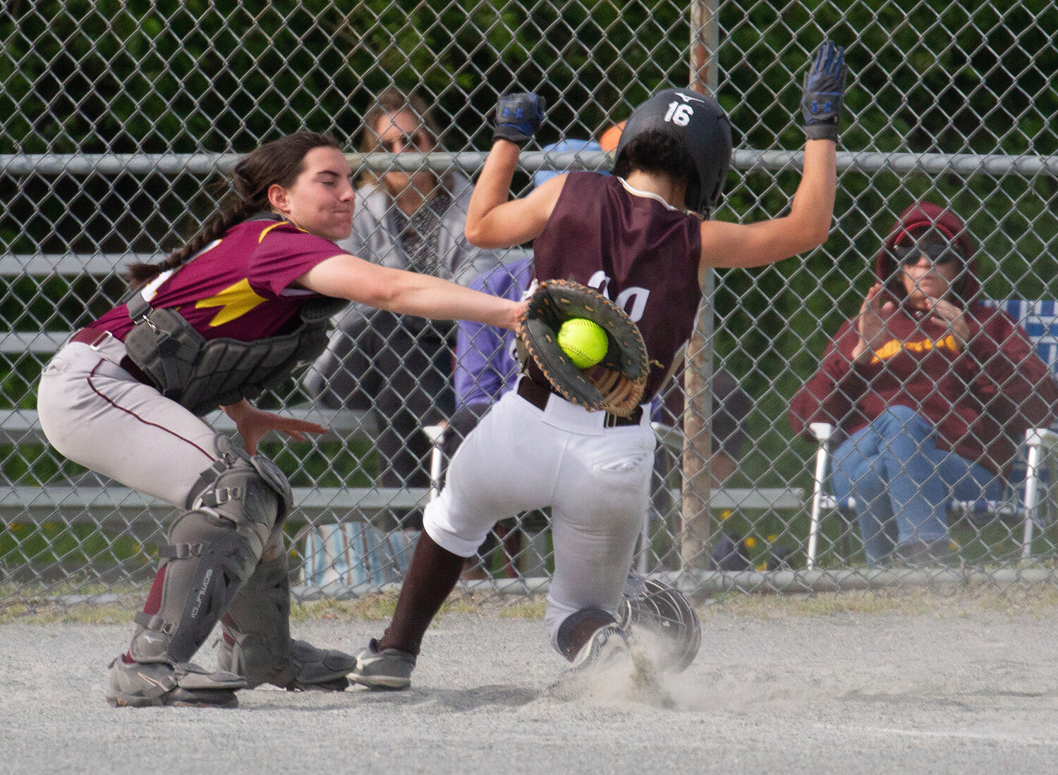 Tess Silvia is called out on a force out at home plate to end the third inning.
