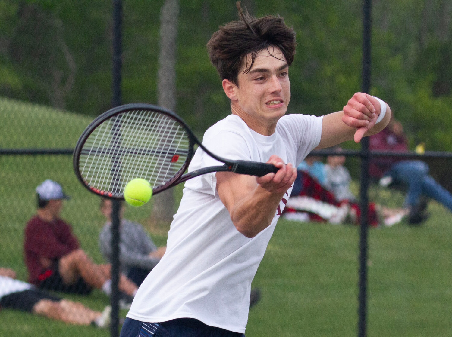 Ben Pacheco hits a forehand during his match. He beat Hadley Martinez in straight sets 6-4, 6-2. 