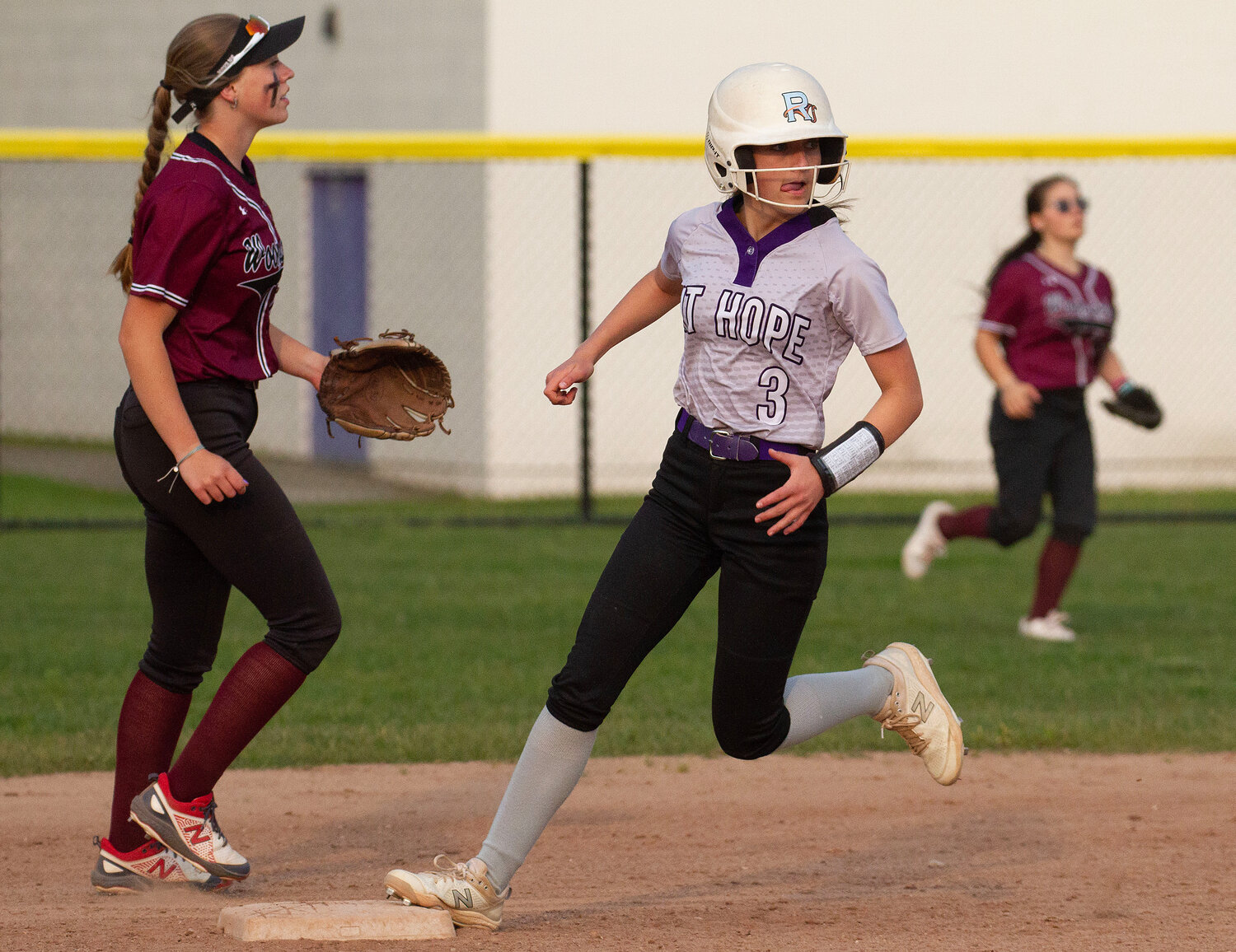 Ava Waddell looks to round second base during the Woonsocket game.