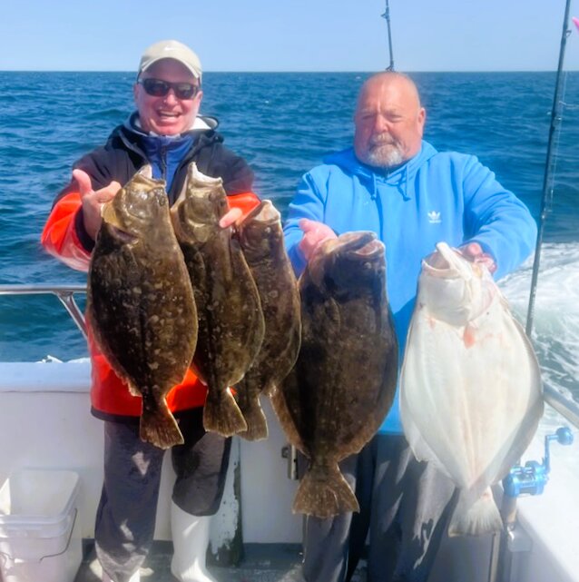 Happy customers aboard the Frances Fleet party boat out of Point Judith, R.I., with the summer flounder (fluke) they caught last week.