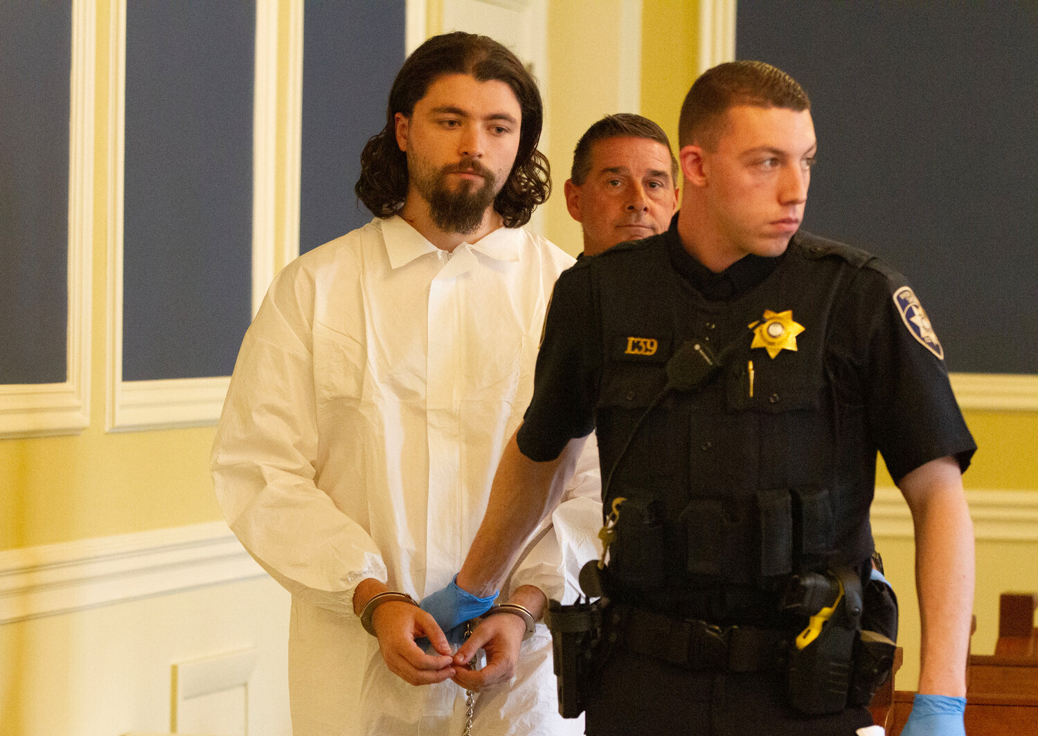 Jacob Morrill is led into court for his arraignment Tuesday.