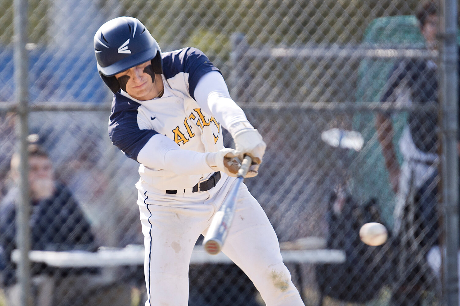 Trevor Snow sends the ball into play while competing against Mount St. Charles, Thursday.