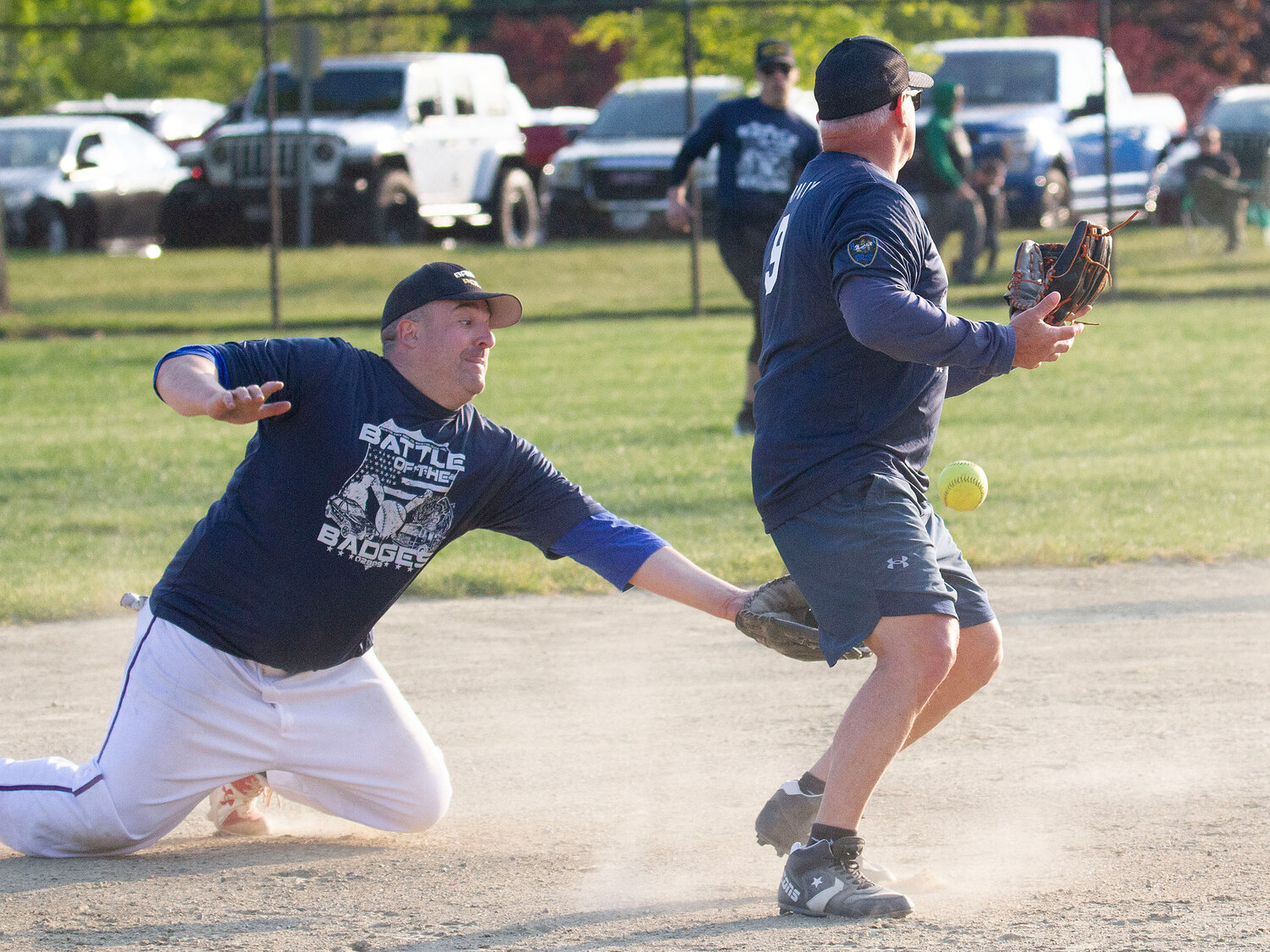 Brandon Correia attempts to grab a grounder bobbled by shortstop Scott McNally.