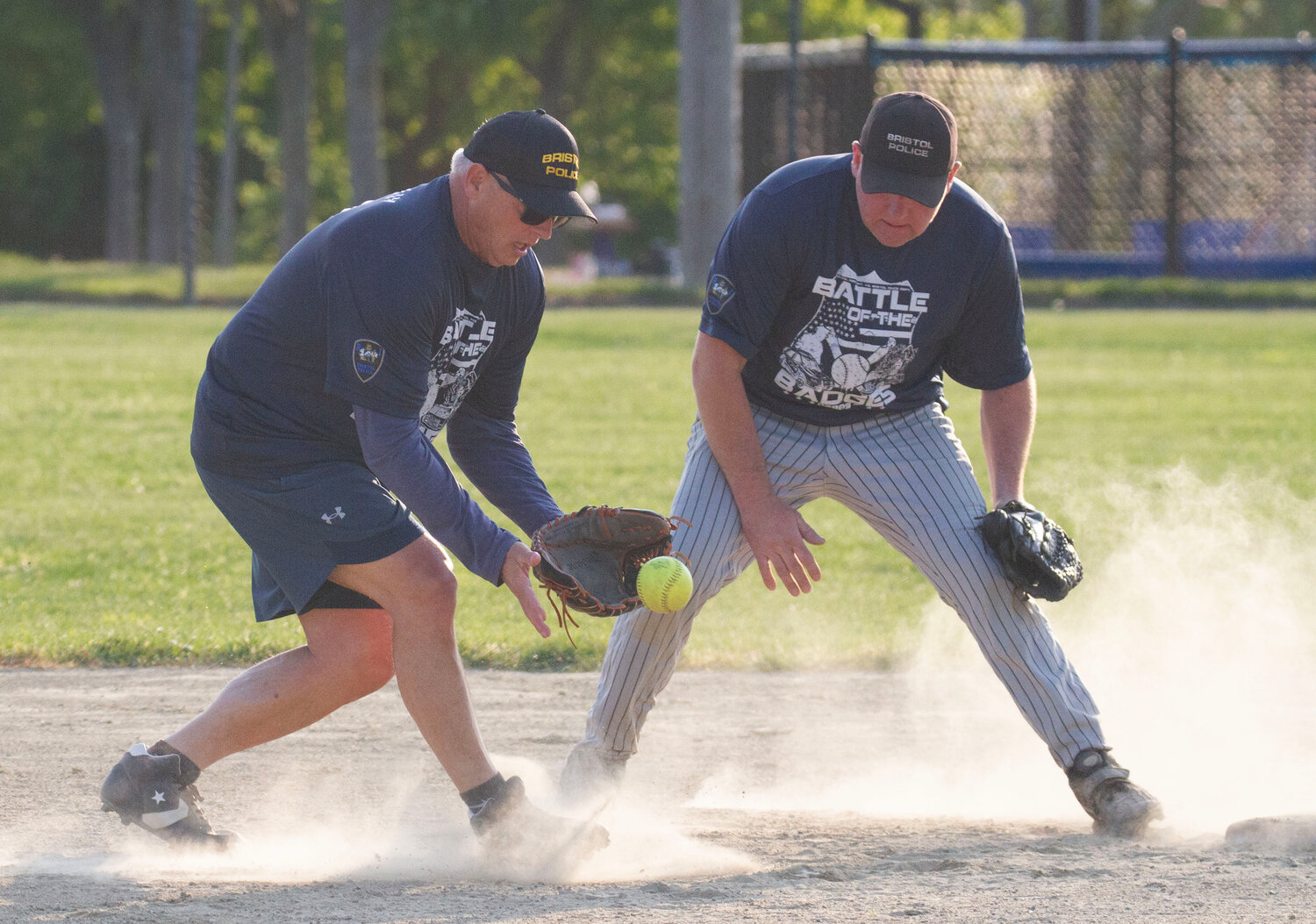 Shortstop Scott McNally scoops up a grounder with second baseman Mike Kelly (right).