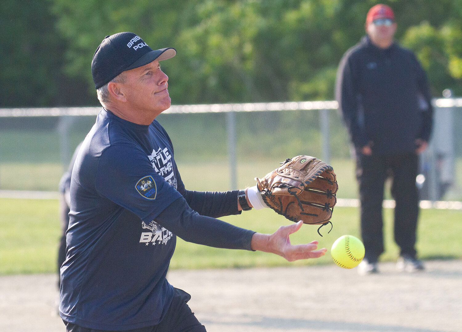 Chief Kevin Lynch tosses a pitch during the game.