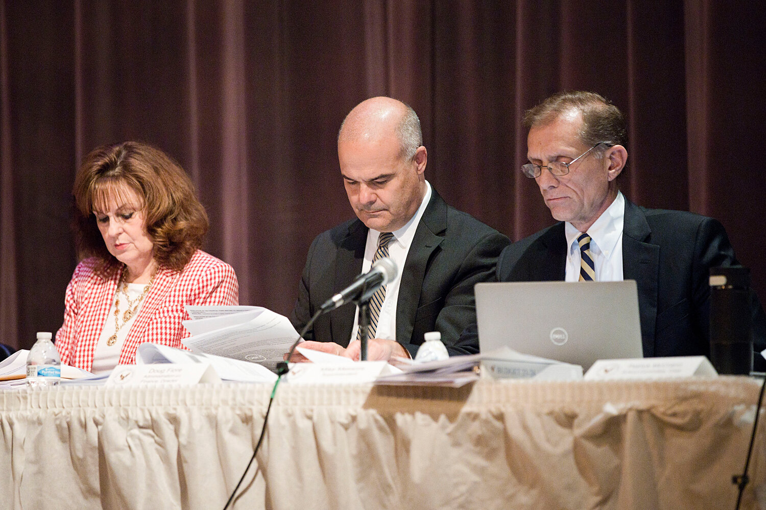 Barrington Schools Superintendent Michael Messore (right) sits beside BPS Director of Finance Doug Fiore (center) and Town Clerk Meredith DeSisto (left) at Wednesday night's FTM.