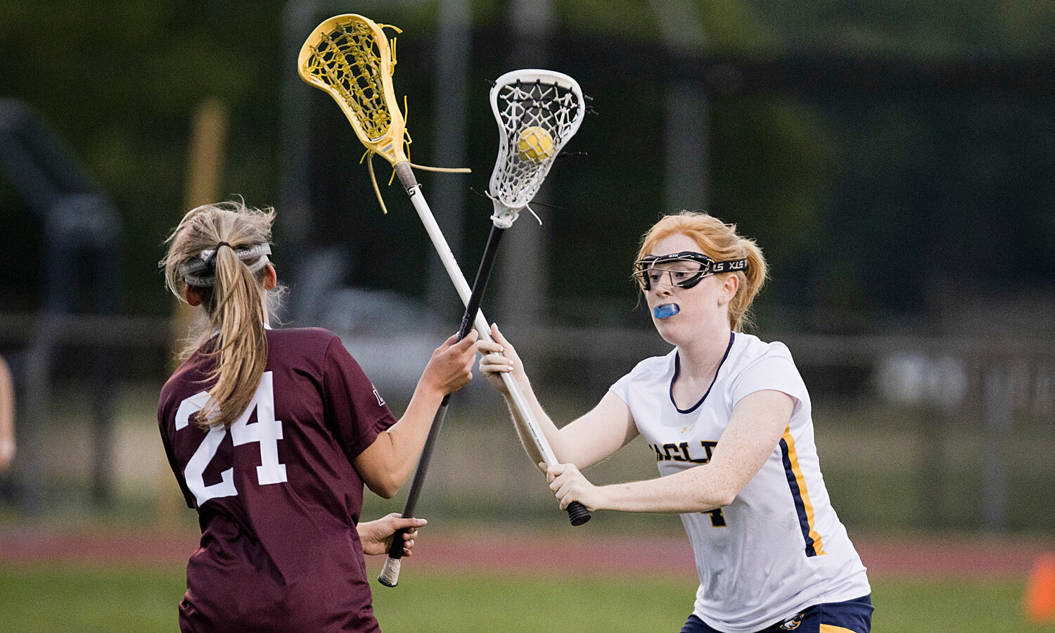 Barrington's Winnie Macaulay (right) forces a LaSalle opponent to pass while playing defense for the Eagles.