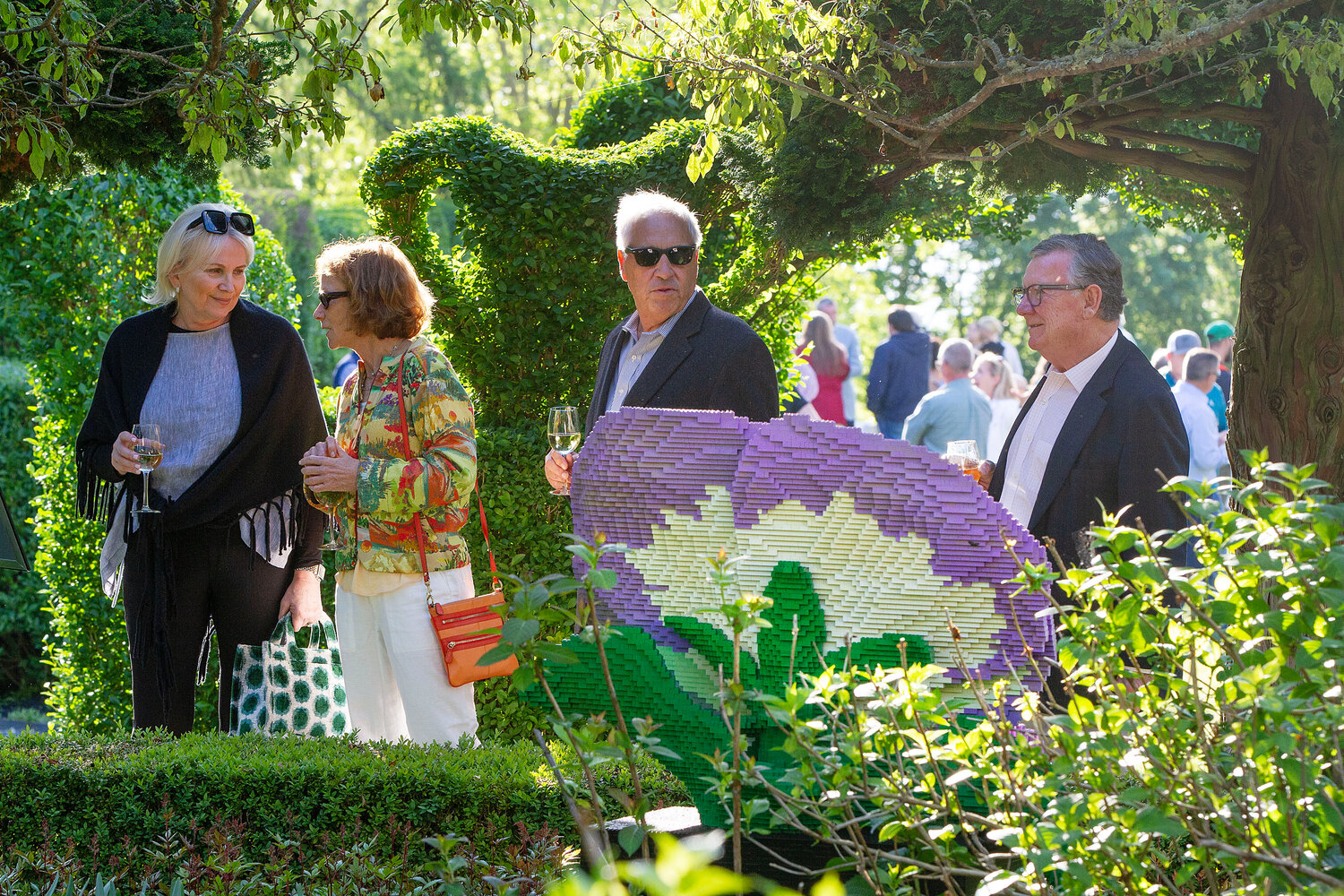 Wendy Pereira, Lisa Perrault, John Pereira and Paul Perrault (from left) check out the Lego creatures/flowers.
