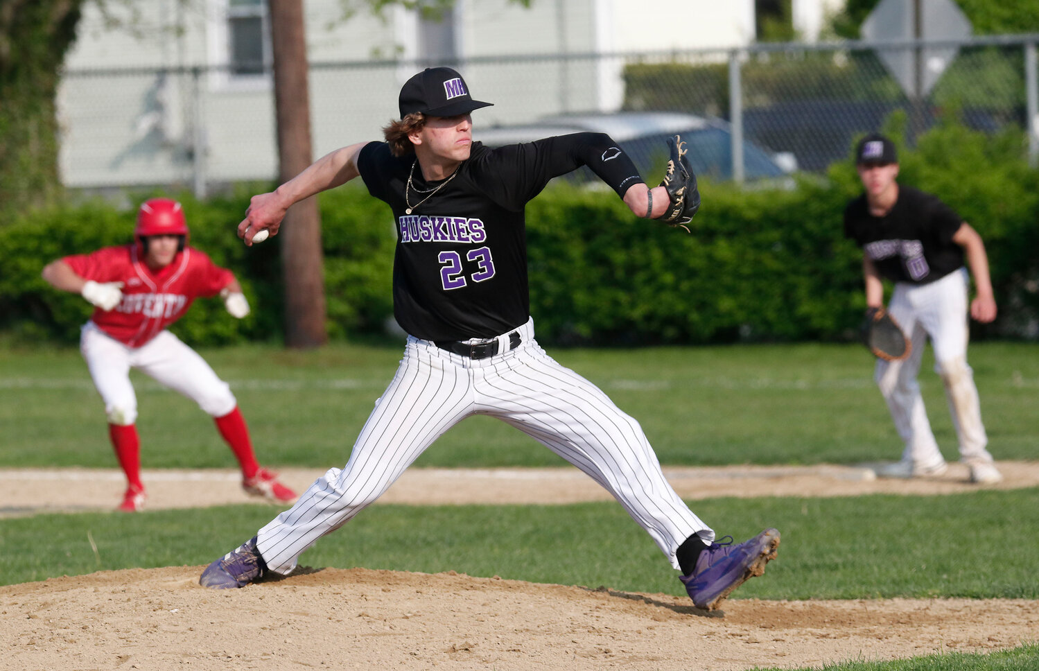 Brad Denson makes a pitch during the team’s game against Coventry. The Huskies will host Central in a Division I preliminary round playoff game at Guiteras Field on Tuesday at 4 p.m.