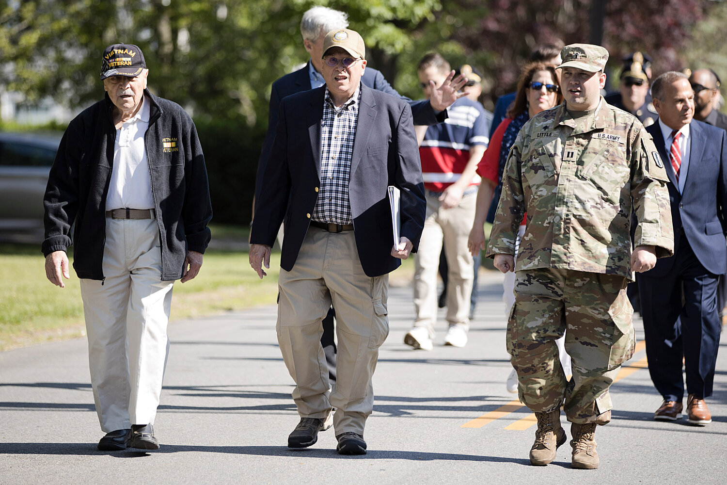 Veterans walk along Upland Way while participating in Barrington's Memorial Day parade, Monday.