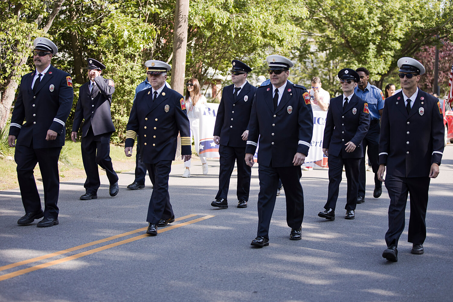 Barrington firefighters march along Upland Way during the town's Memorial Day parade, Monday.