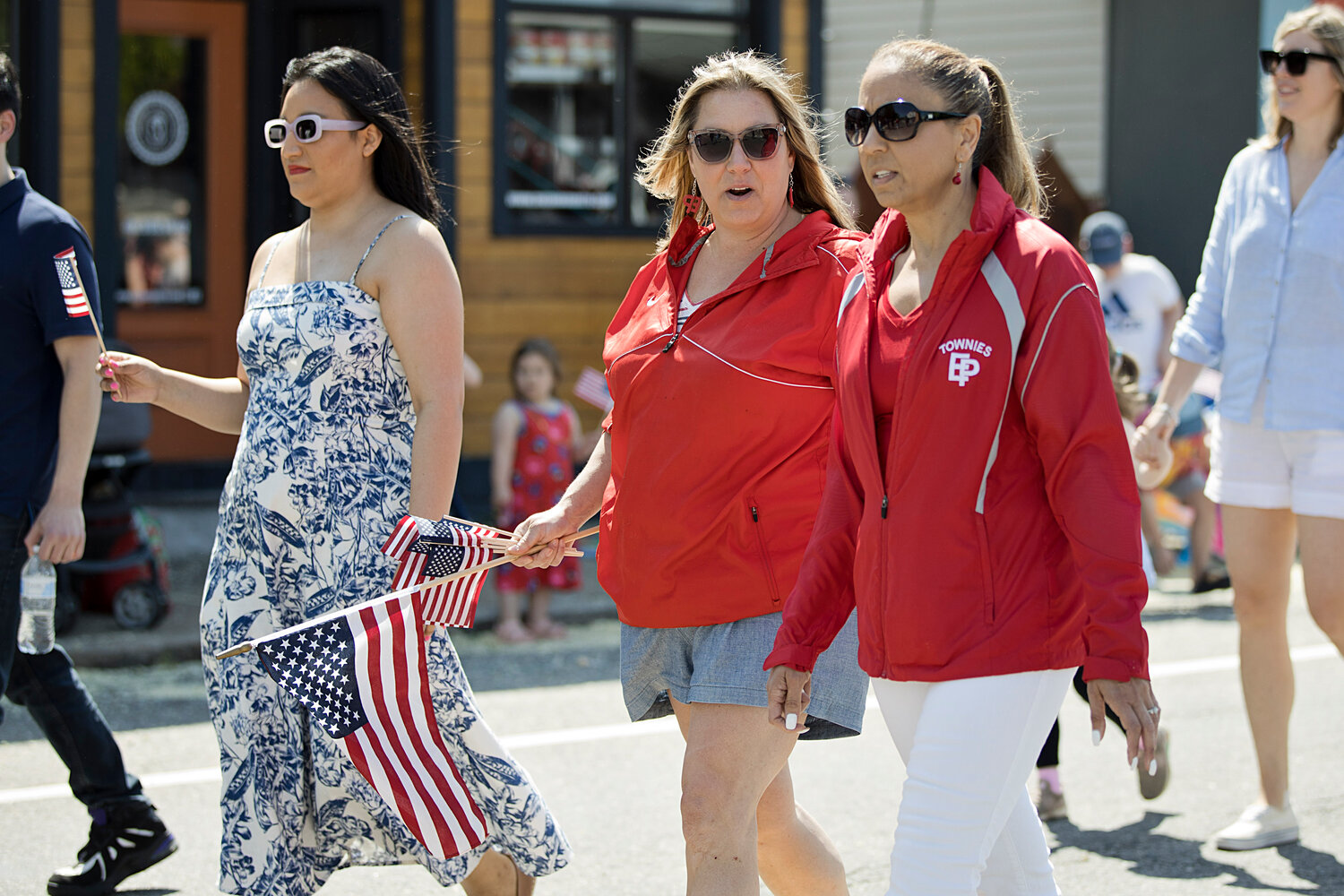 Superintendent of School Sandy Forand (right) walks the parade with members of the administration.