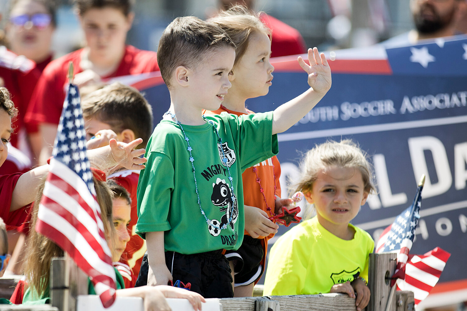 East Providence Youth Soccer player Ryan Murphy waves to spectators.