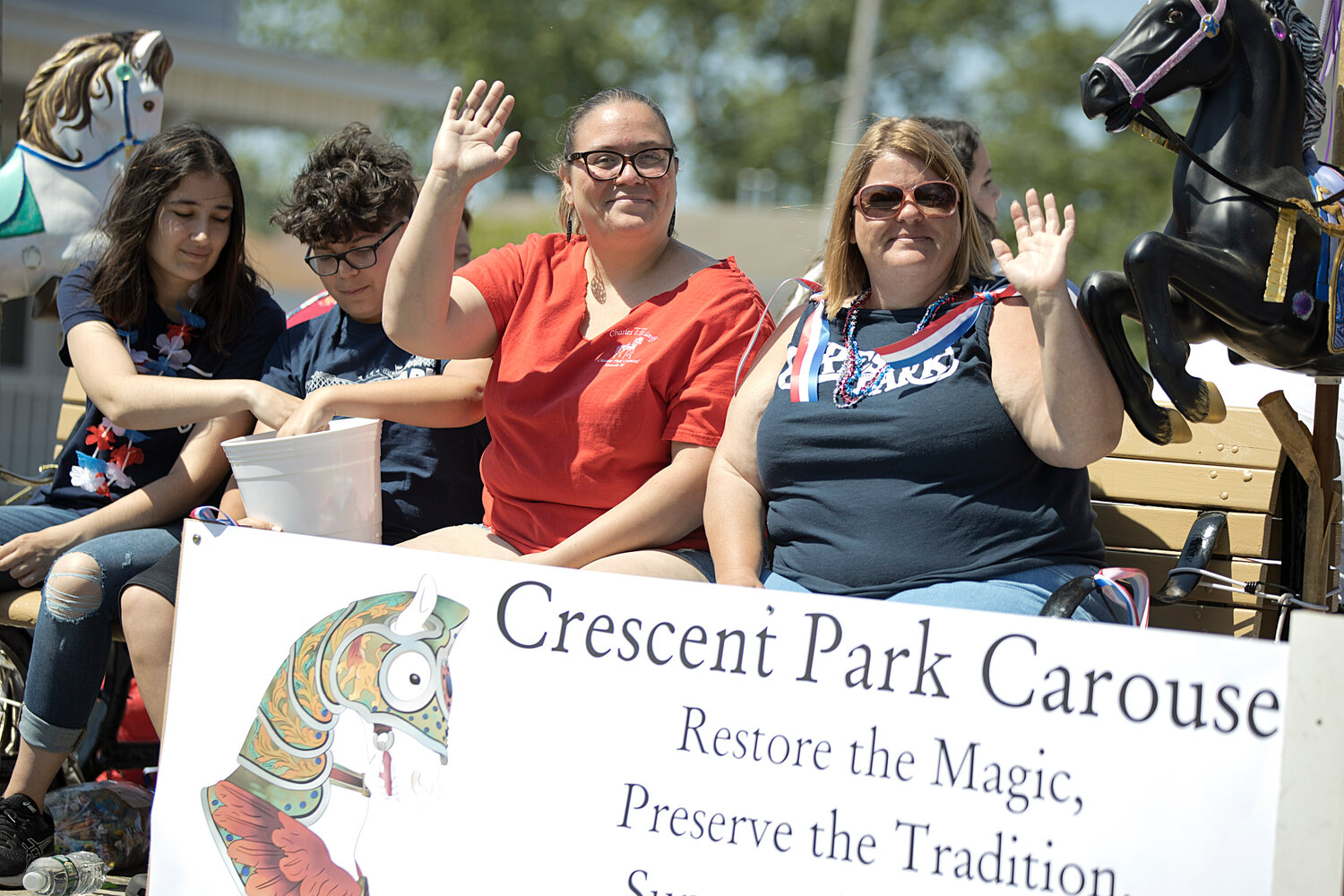 Crescent Park/Looff Carousel staff walk the parade.