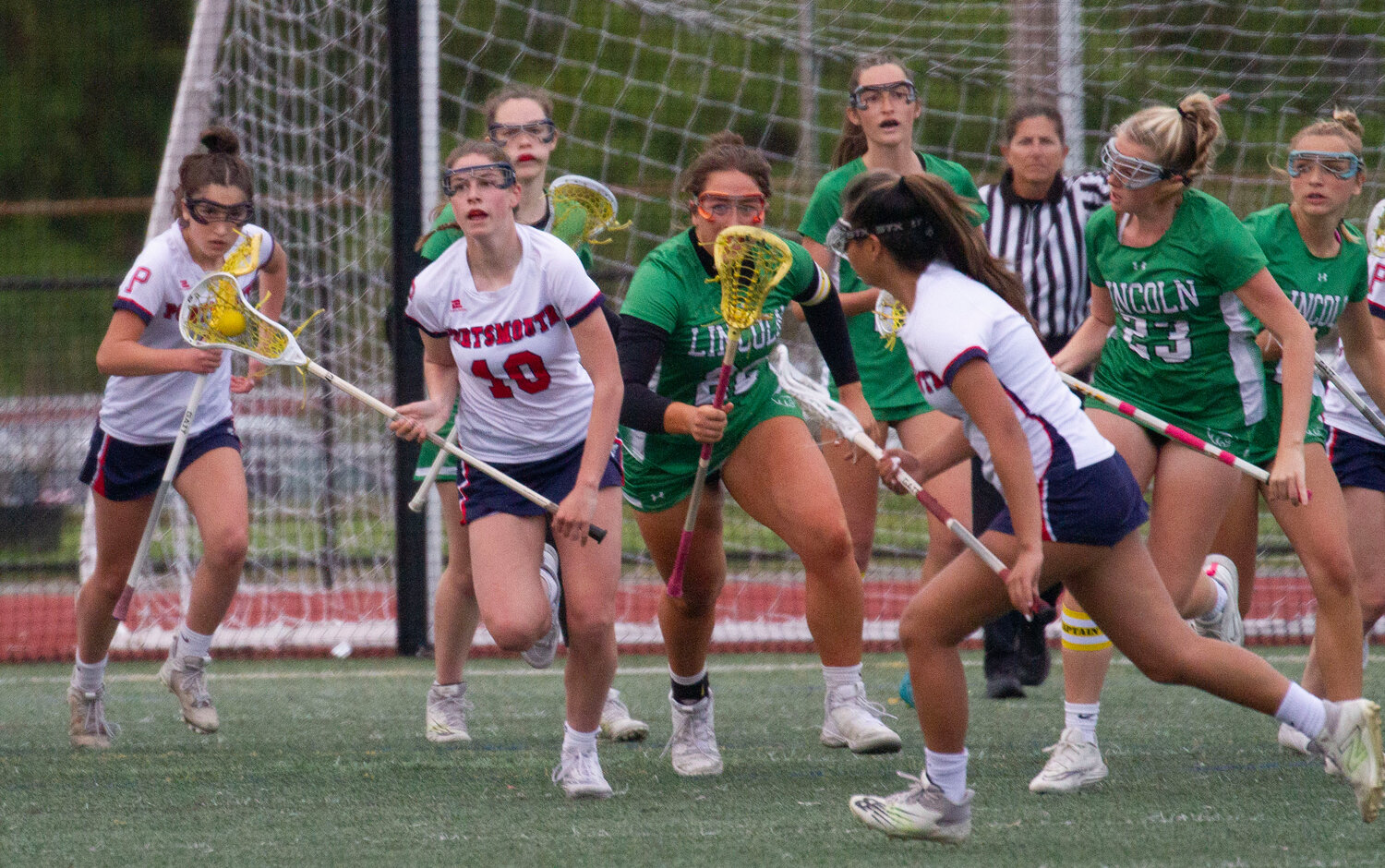 Kaitlin Roche steals the ball in the Patriots’ defensive end and heads upfield.