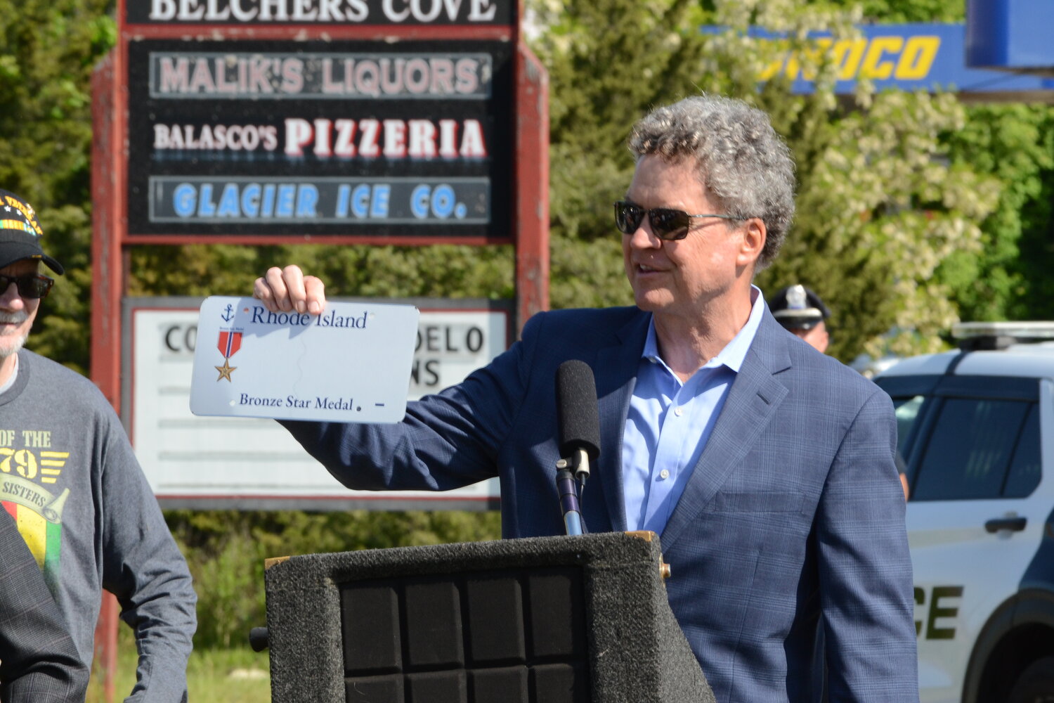State Senator Walter Flag Jr. holds up the first printed Rhode Island Bronze Star plate, which was a goal of Siembab’s for years. Flag presented the plate to Siembab’s wife, Sandi, during Sunday’s ceremony.