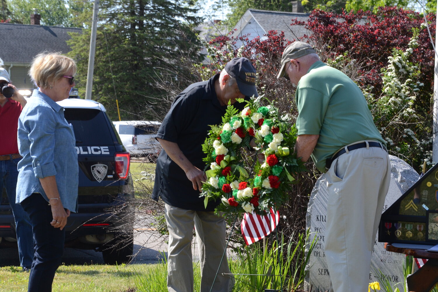 Sandi Siembab looks on as a wreath is placed in honor of her late husband, Stephen “Mike” Siembab, on Sunday morning at the Vietnam Memorial in Warren. The couple was married for 49 years, and their 50th anniversary would be on June 15.