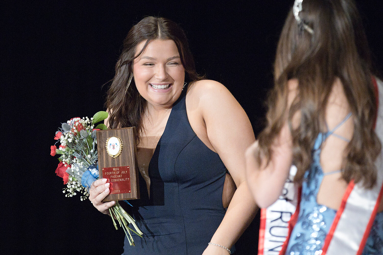 Mia Padula is congratulated after being named Miss Congeniality and first runner-up in the 75th annual Miss Fourth of July Pageant Saturday.