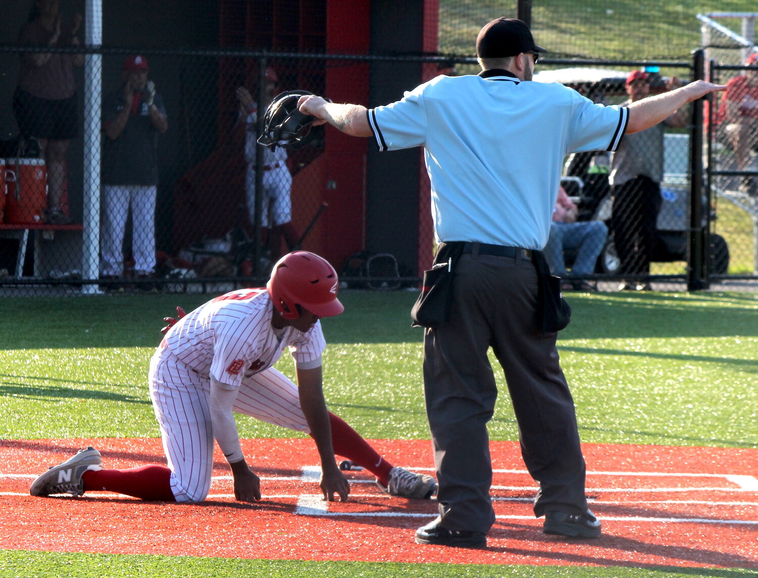 Zuriel Vargas slides safely into home with the third EPHS run of the first inning of the Townies' eventual 9-1 win over Ponaganset.