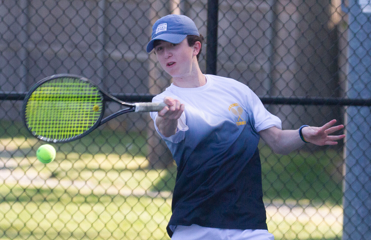 Bryce Kupperman hits the ball during the number one doubles match against Mount St. Charles.