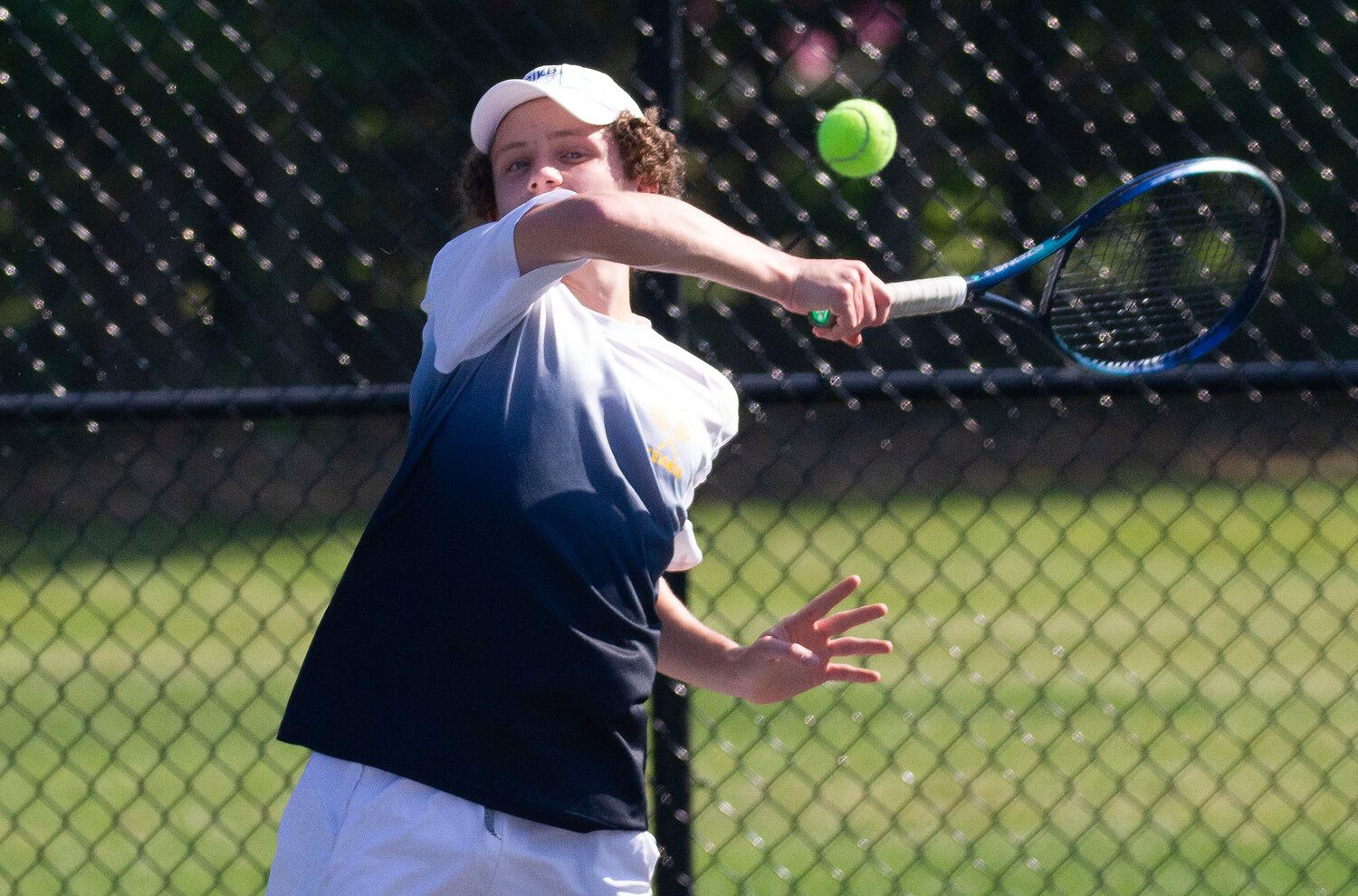 Barrington's Charlie Martin hits the ball during his match against Mount St. Charles.