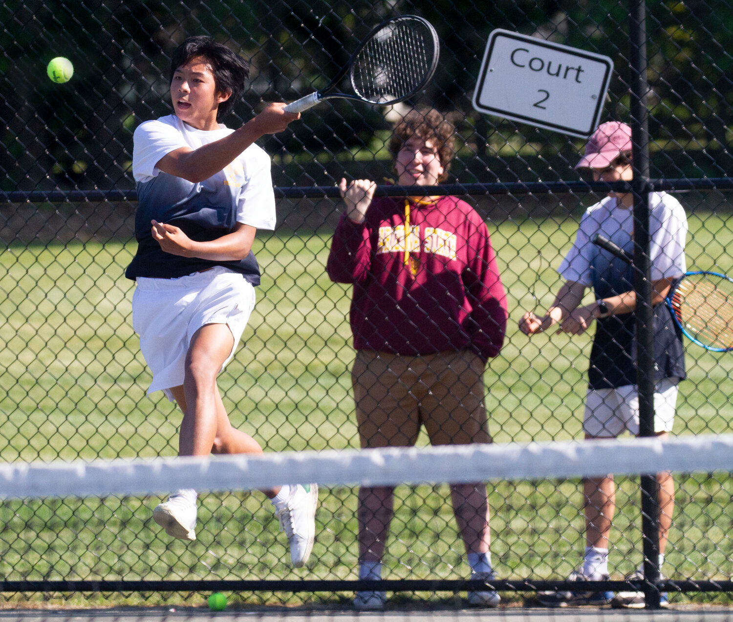 Barrington's Jeremy Kuo crushes a shot while fans watch just outside the fence. The Eagles knocked off Mount St. Charles 4-0 and advanced to the state finals.