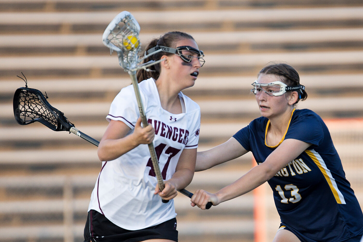 Hannah Jackson pushes an East Greenwich opponent away from the goal.