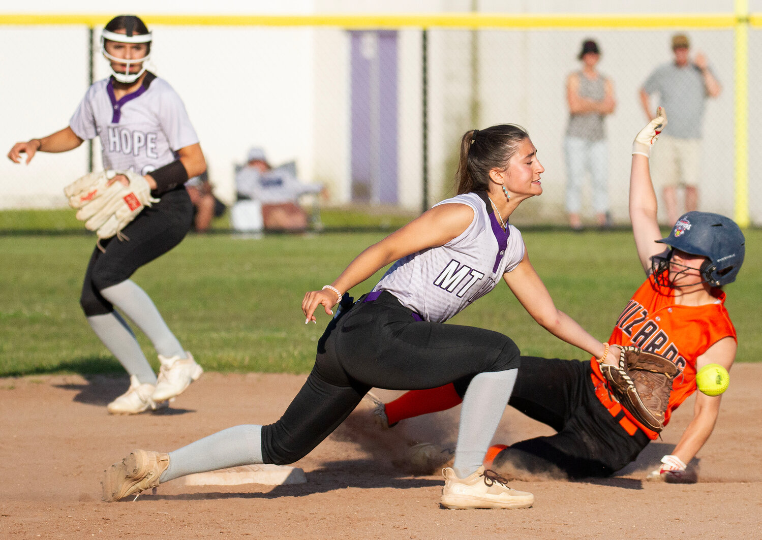 Shortstop Julia Allen scoops up a throw by catcher Ava Waddell on a West Warwick steal of second base.
