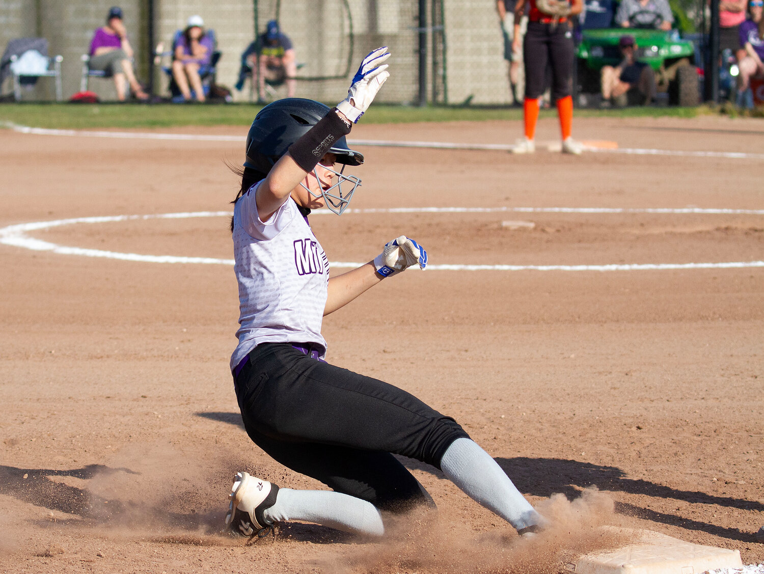 Elsa White slides safely into third base in the first inning. She later scored on Reily Amaral's base hit.
