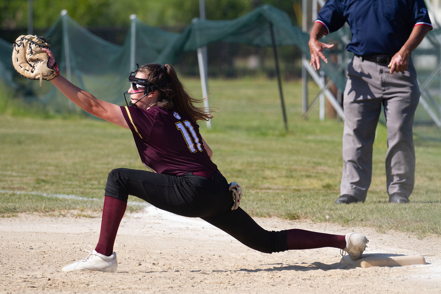 First baseman Abby Monkevicz stretches to make an catch for an out.