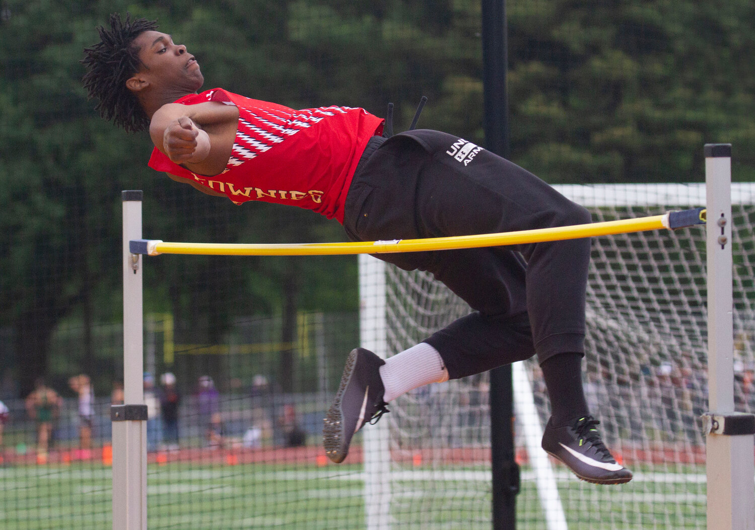 Kenaz Ochgwu vies in the boys' high jump for EPHS, in which he placed.