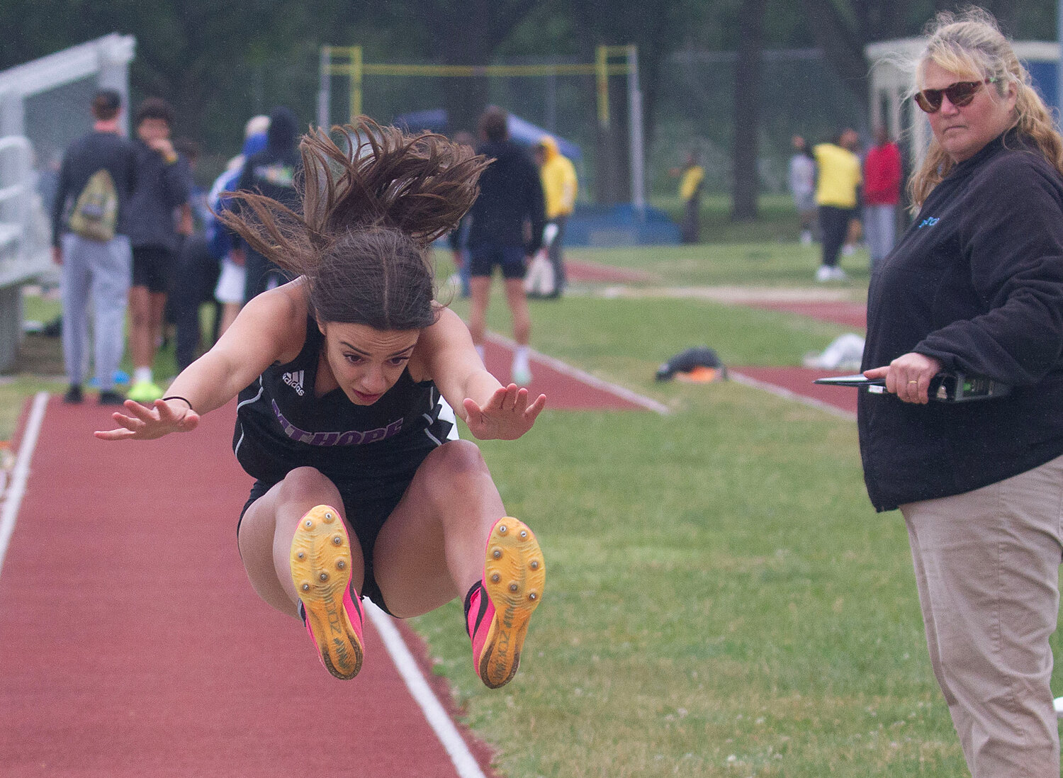 Thea Jackson makes a jump during the long jump event. 