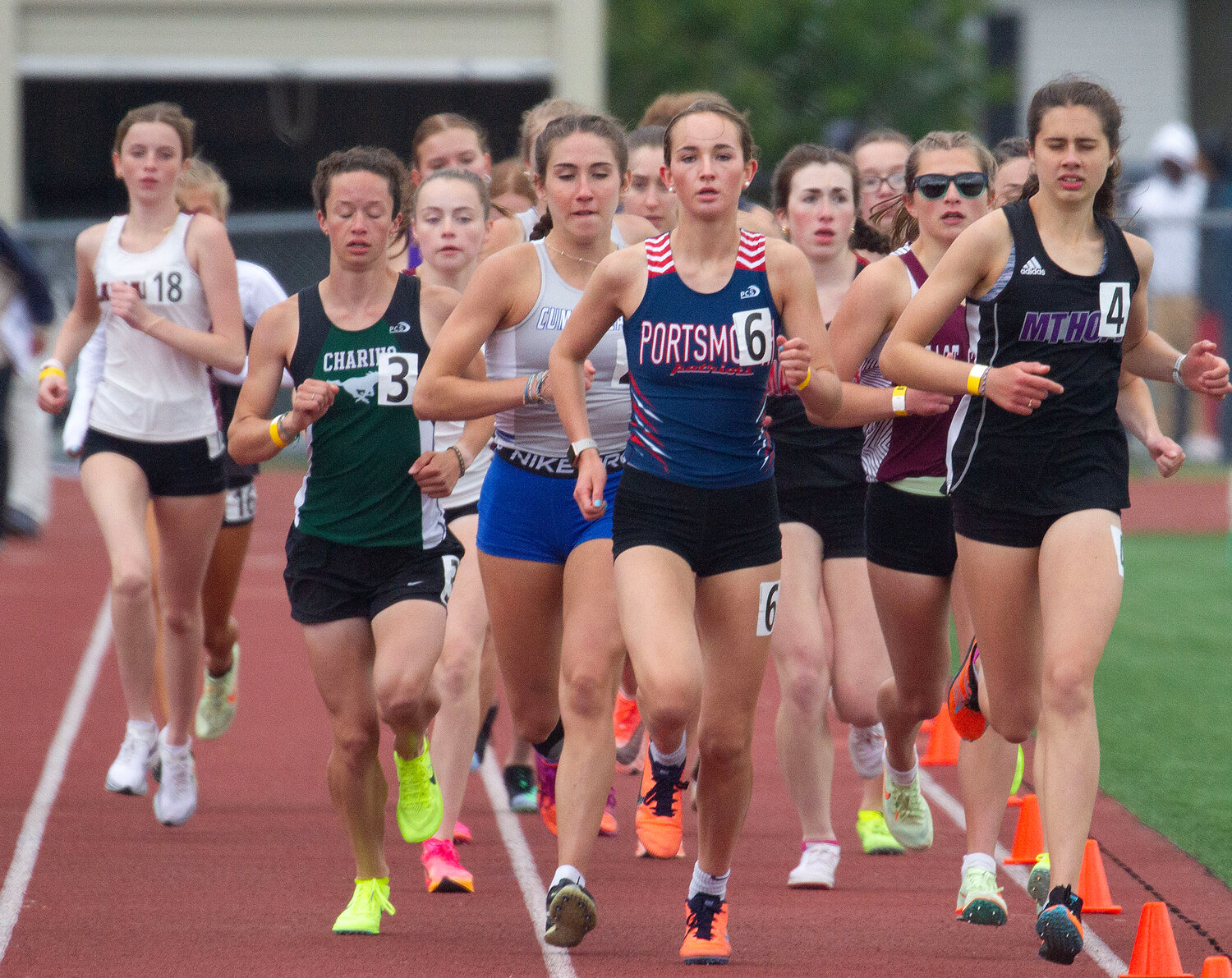 Jessica Deal (right) keeps pace with Portsmouth's Allie Kaull (middle) and the leaders during the 3000-meter run.