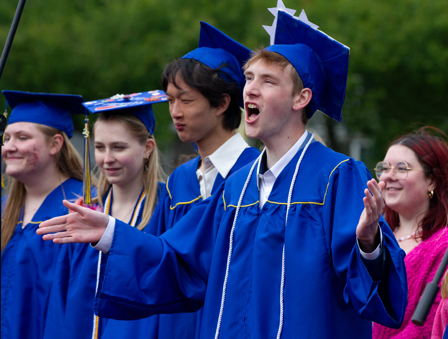Soloist Max Bleakney sings during Sunday’s graduation ceremony at Barrington High School.