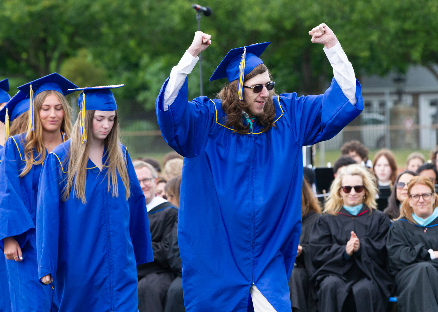 Kyler Romano pumps his fists in the air as his name is called during the BHS graduation ceremony on Sunday.