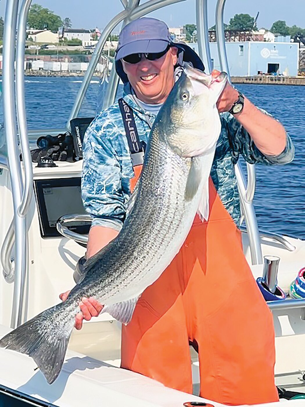 Mike Swain of Coventry, an expert large striped bass angler, caught and released this 30-pound striper last weekend in the upper Providence River, using a live Atlantic menhaden (pogie) as bait.