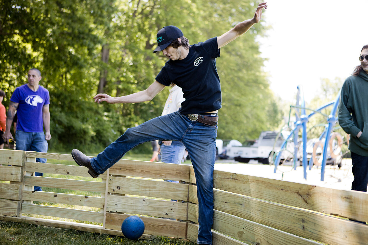 Nate Evans leaps over a ball while trying out the new Gaga Pit.