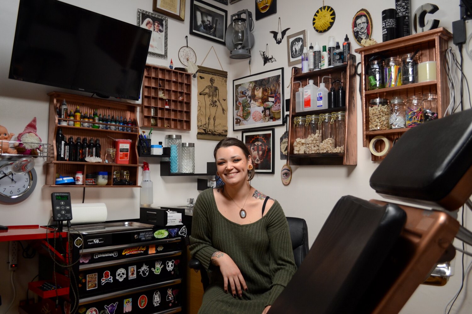 Chrystal Santos sits in her office at Eclectic Body Art, located at 446 Main St. in Warren. At one point she was the youngest licensed tattoo artist in the state, and is now running her own shop at just 26 years old.