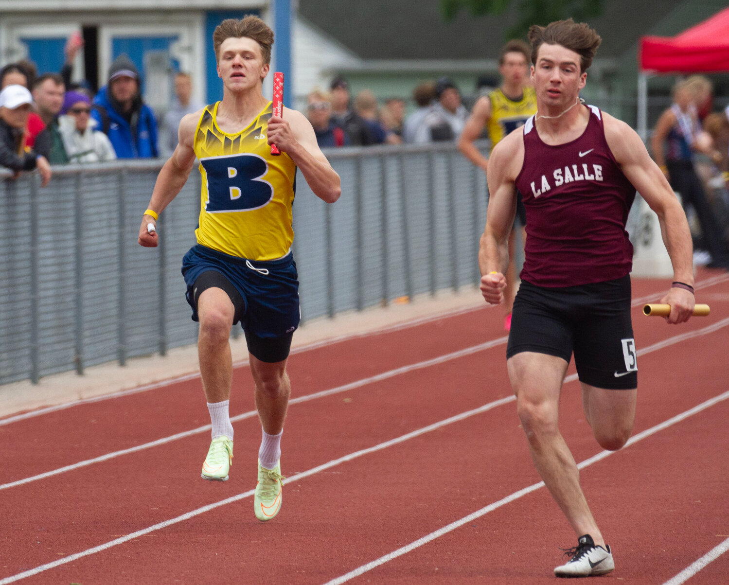 Barrington High School's Iain DeBoth (left) and LaSalle's Brady Fisher, of Barrington, compete in the 4x100-meter relay race at the state track championship.