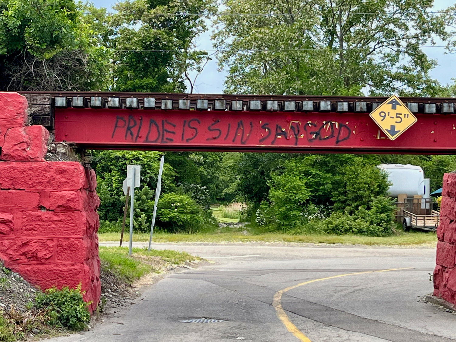 The railroad bridge entrance to Common Fence Point was struck with this graffiti just hours before a Pride Market fund-raiser was held in the neighborhood on Saturday. It has since been painted over.