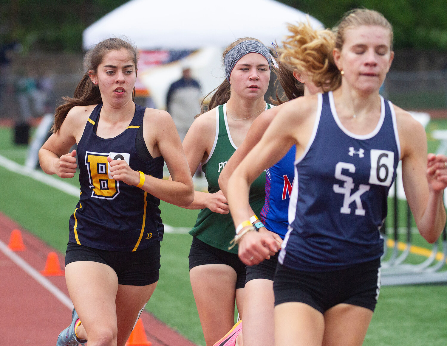 Barrington's Caroline Reznik (left) competes in the 1,500-meter race at the state track meet.