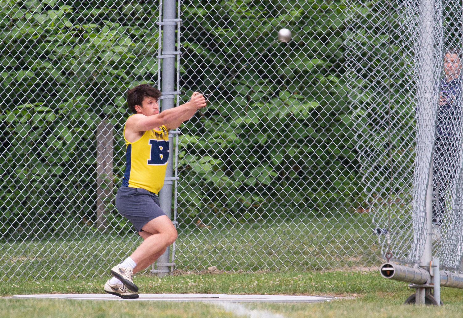 Barrington's Michael Fay throws the hammer at the state track meet.