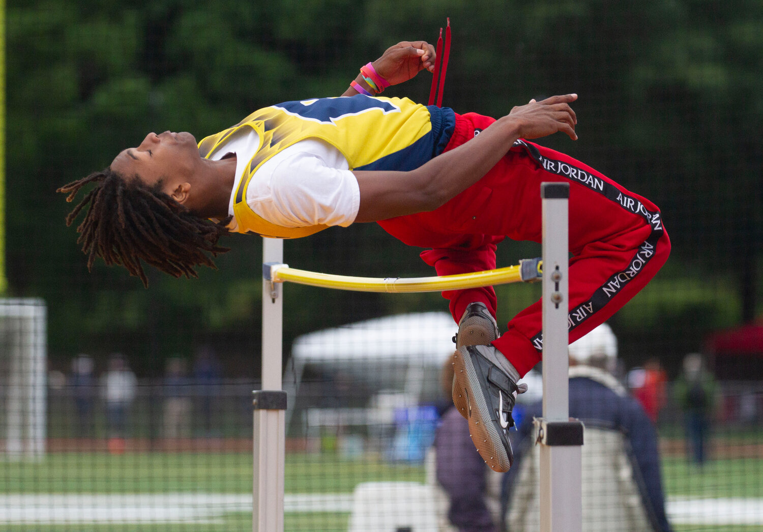 Barrington's Chucky Potter clears the bar with room to spare during the high jump event at the state track meet.