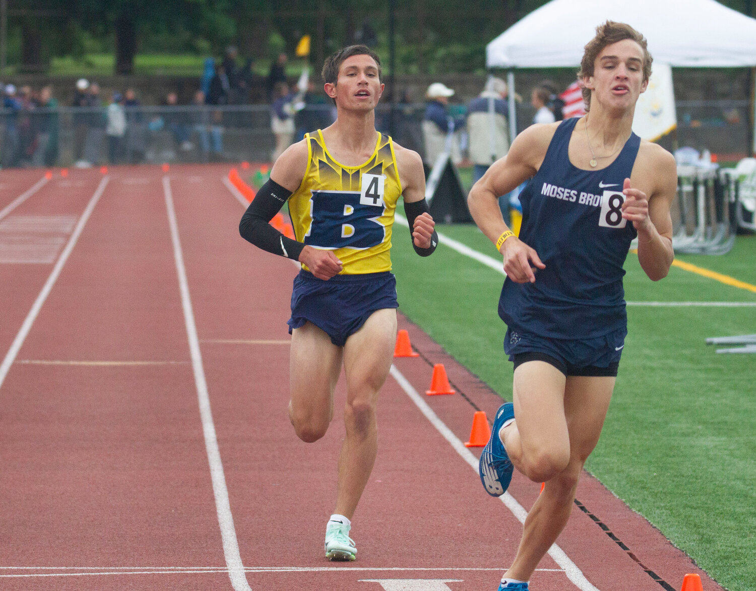 Barrington's Charlie Stockwell (left) competes in the 1,500-meter race at the state track meet.