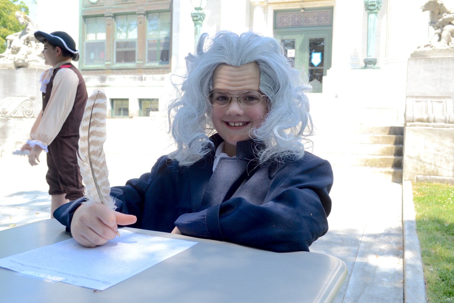 Ben Campbell portrays Benjamin Franklin, complete with a desk and a quill pen to enable him to perform his important duties as a Founding Father.