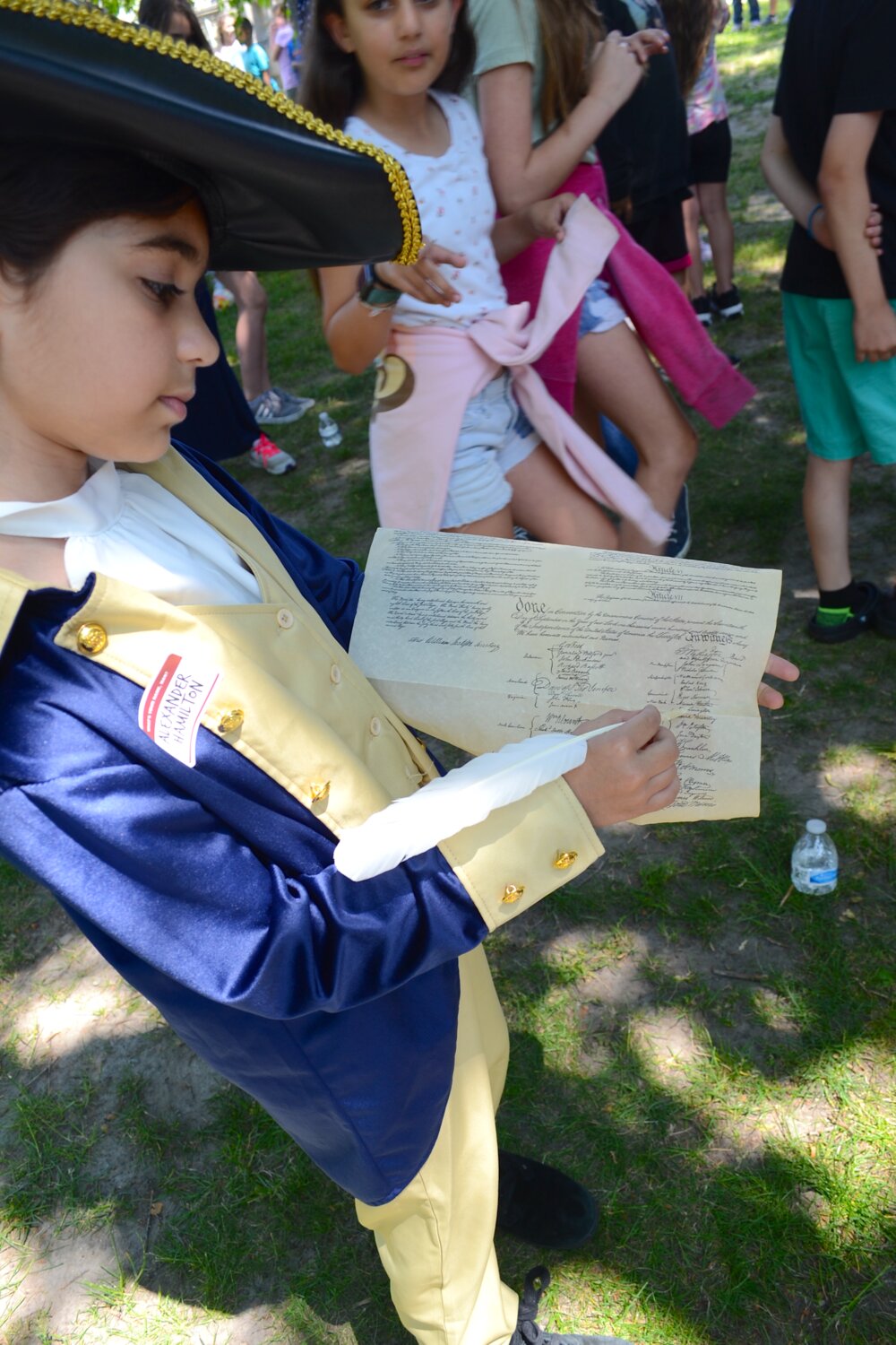 Stella Viswanath points to where her historical figure, Alexander Hamilton, signed his name on the Declaration of Independence. She said she had seen the ‘Hamilton’ musical at least four times, and had memorized some of the songs.