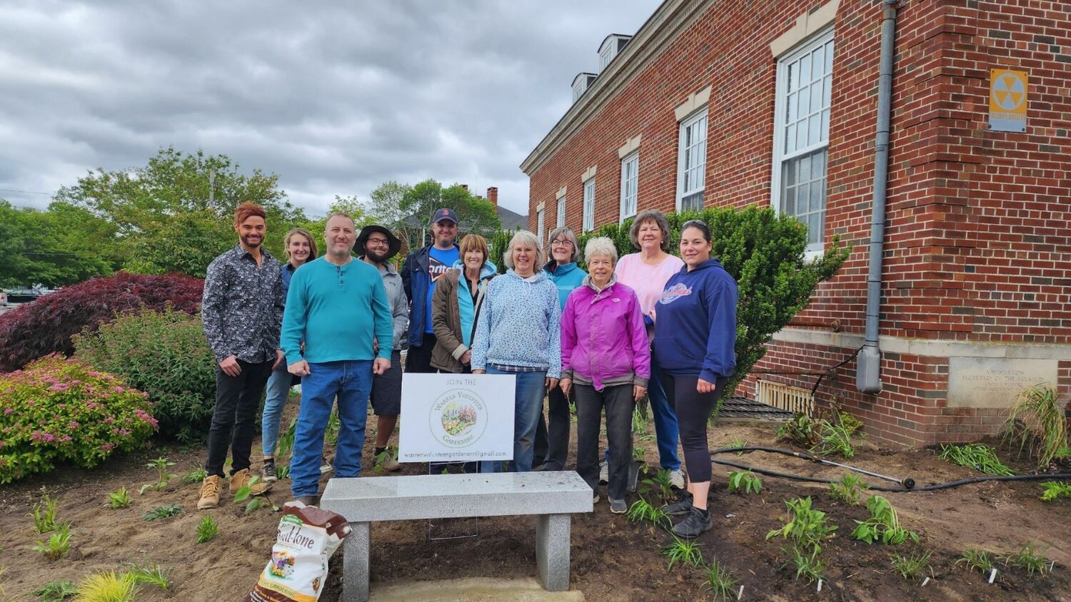 A group shot of some of the volunteers who helped plant wild species at the Warren Post Office.