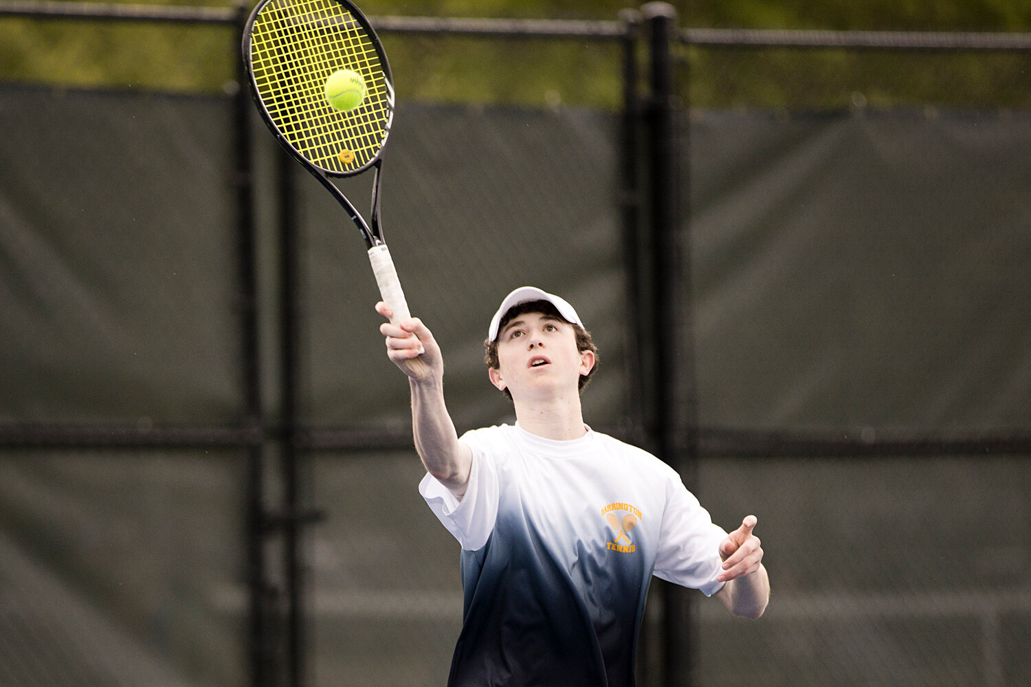 No. 1 doubles player, Bryce Kupperman, sends the ball back to LaSalle opponents.